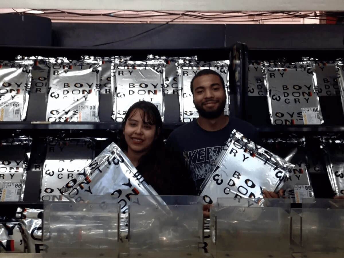 frank and a fan inside of his pop-up store