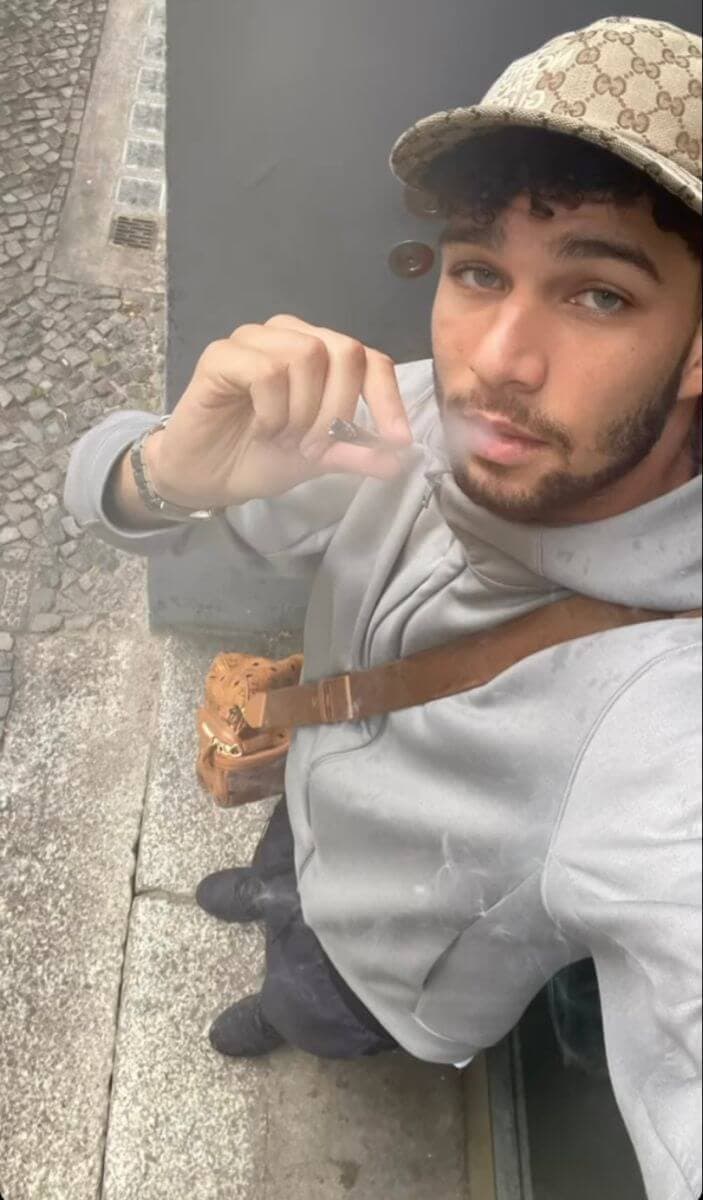 German rapper Lucio101 showing off his gucci cap
