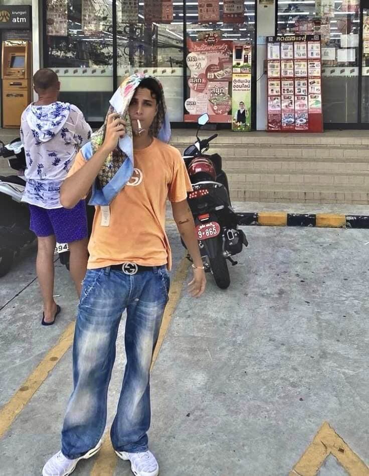 Pashanim showing off his gucci t-shirt and belt, while combining it with a gucci silk cloth