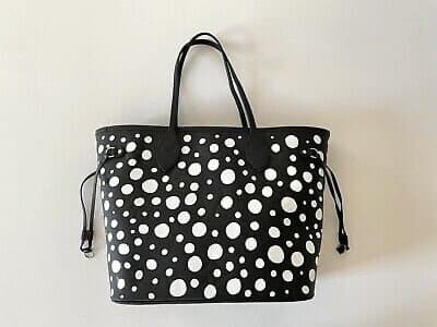 A tote bag out of their first collection, covered in infinity dots